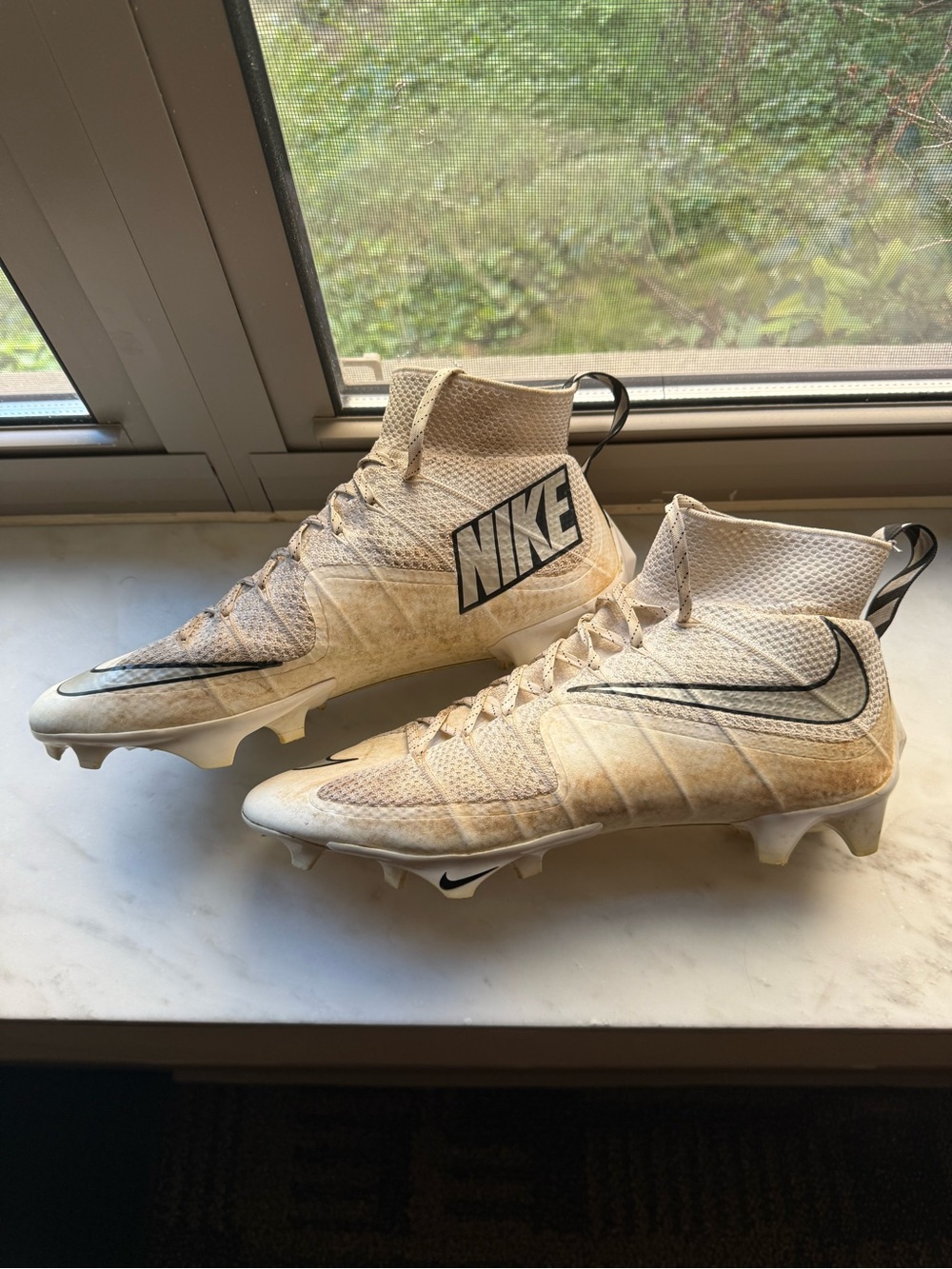Nike Cream/White High-Top Football Cleats with Black Swoosh